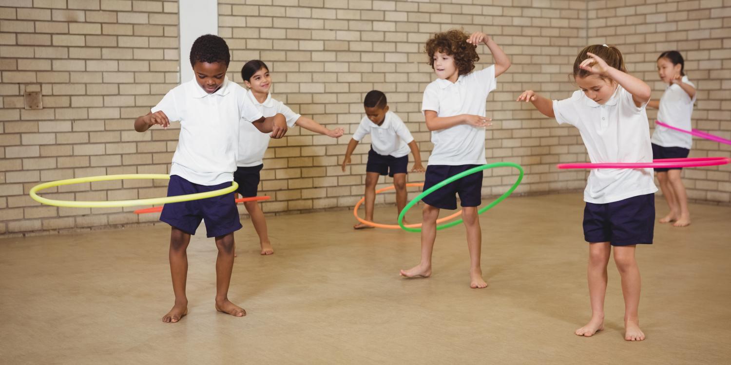Children try hula hooping